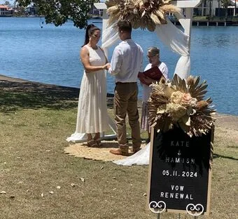 Bride and groom holding each other at their wedding vow renewal ceremony